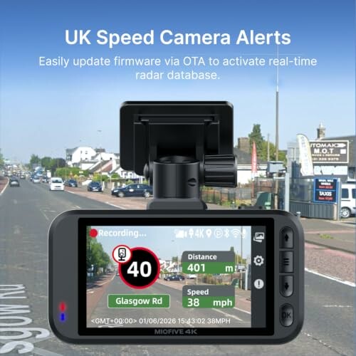 Dashboard display showing UK speed camera alerts and road information.
