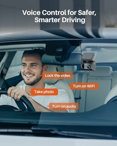 Man using voice-controlled dashcam in car.